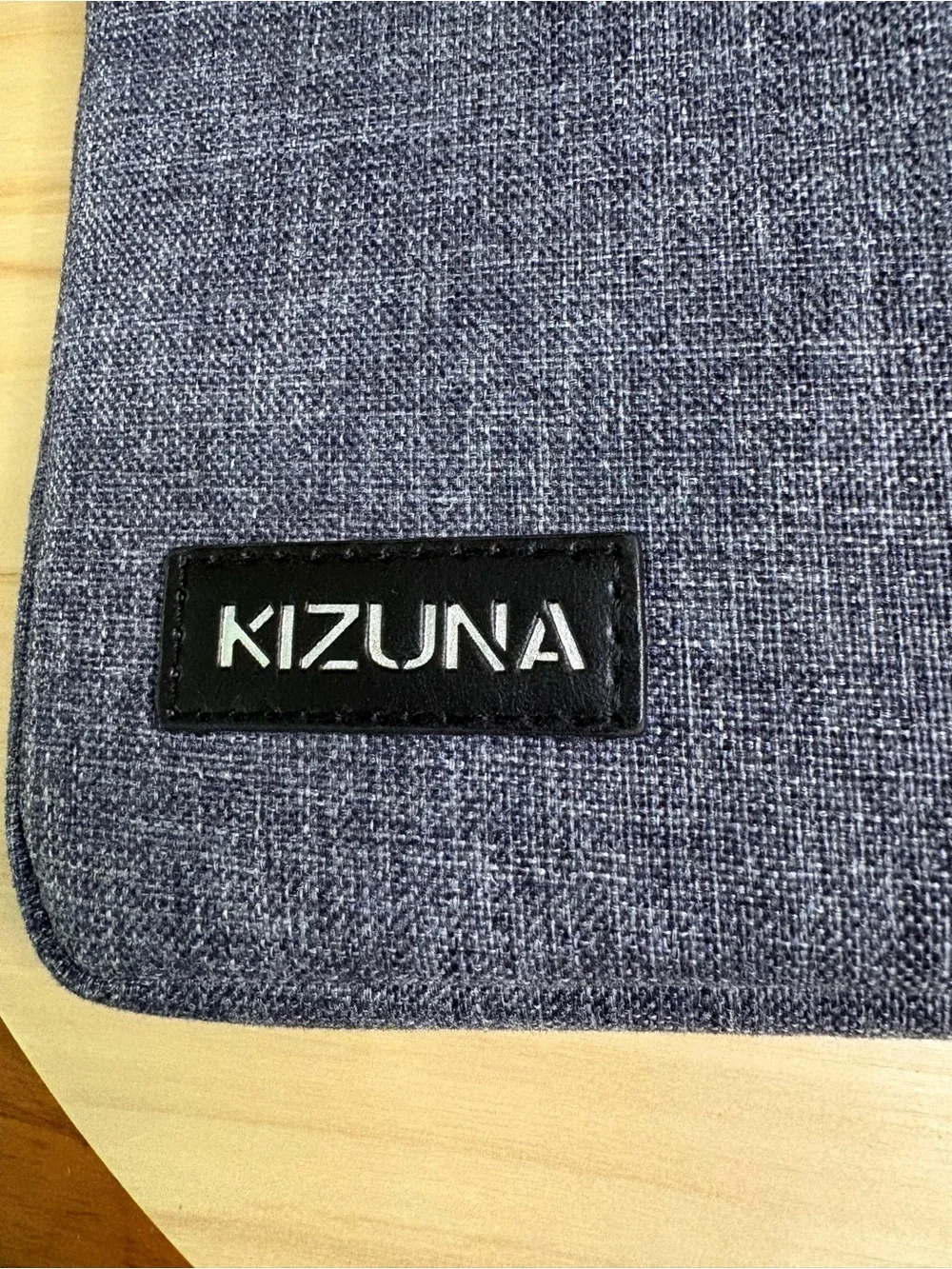 Kizuna water-resistant gray fabric laptop sleeve features a soft interior lining